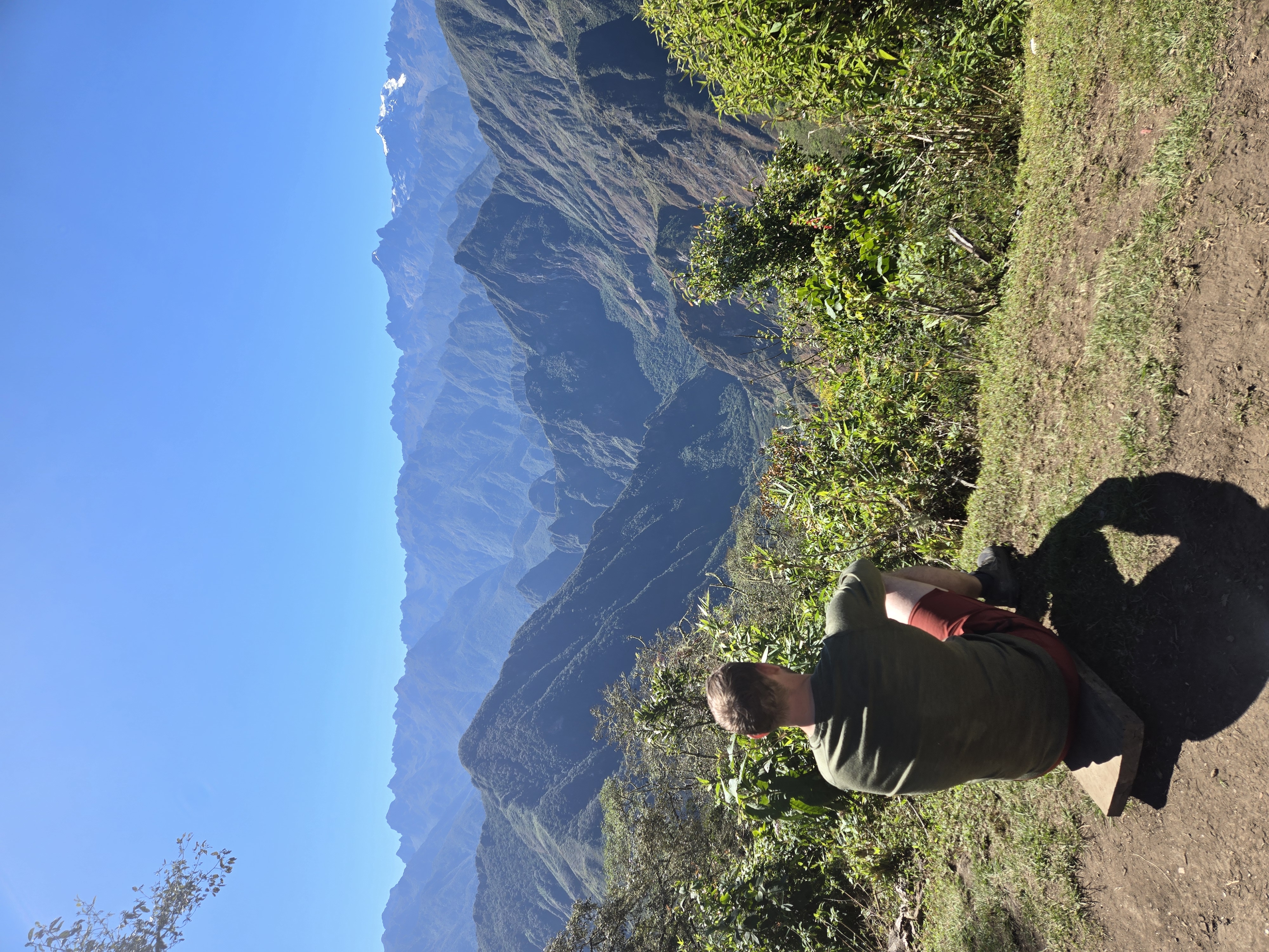 A hiker looking toward Machu Picchu in the distance