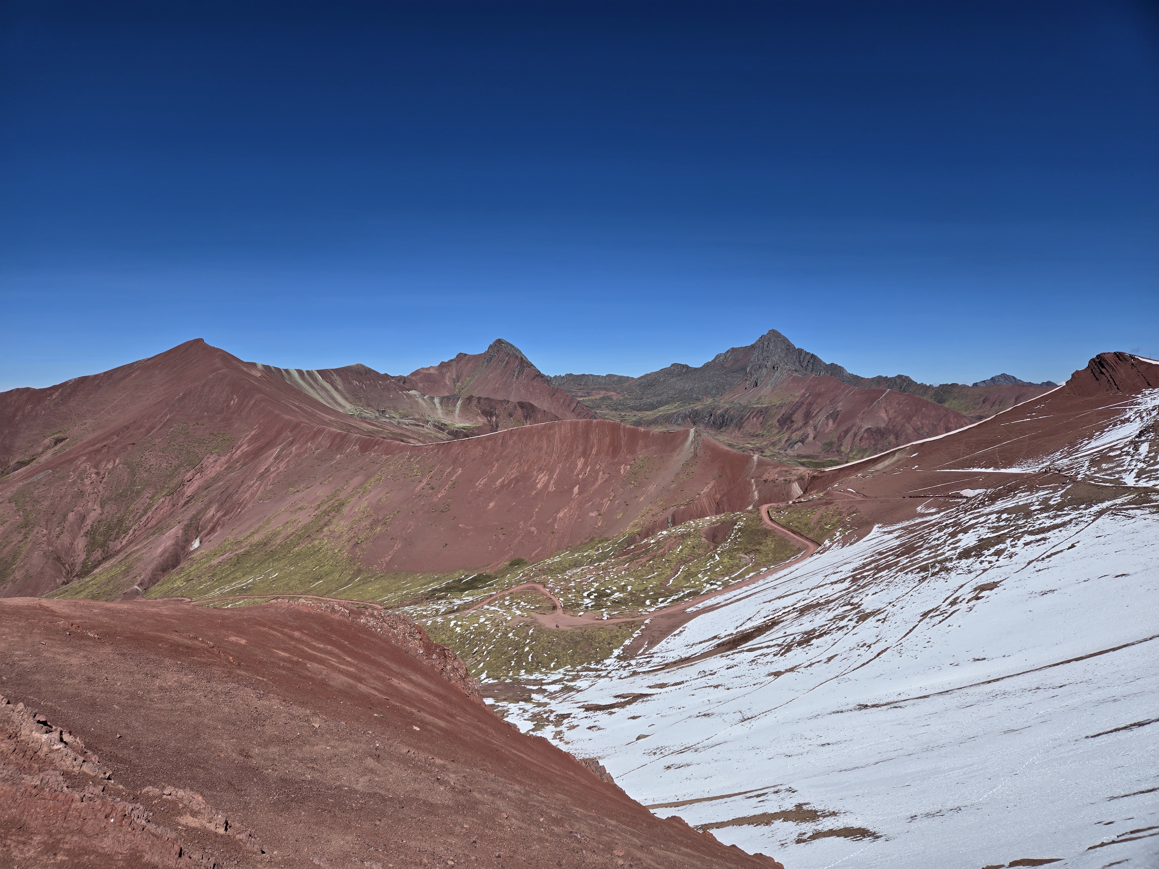 Red mountains and valleys near Rainbow Mountain