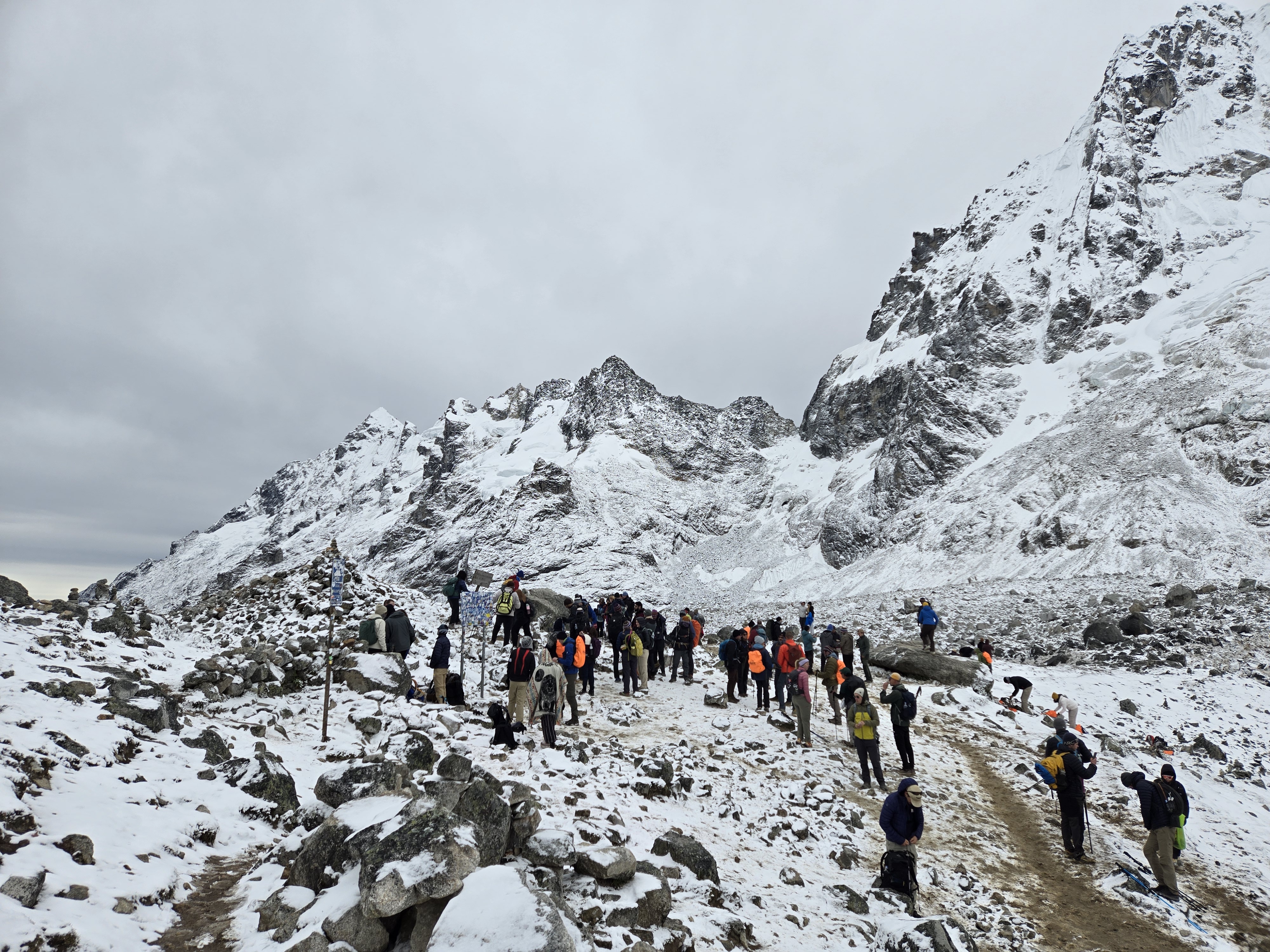 Standing near the summit of Salkantay Pass surrounded by mountains